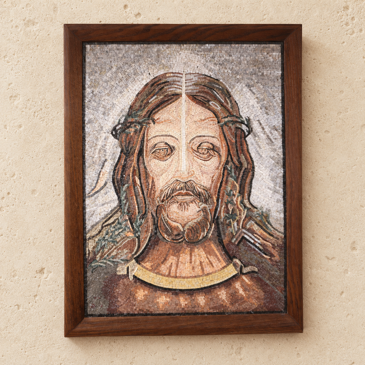 Mosaic portrait of the face of Jesus wearing a crown of thorns, made with Holy Land stones, with a Nativity scene worked into the details